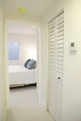 a white room with a bed and a window at Apt 2 Miami Designer Apartment in the Upper East-Side in Miami