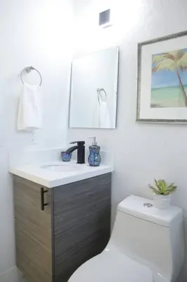 a white bathroom with a sink and a toilet at Apt 2 Miami Designer Apartment in the Upper East-Side in Miami