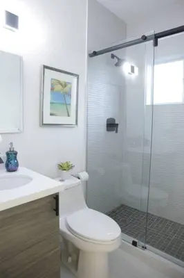 a bathroom with a toilet and a glass shower at Apt 3 Miami Designer Apartment in the Upper East-Side in Miami