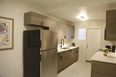 a kitchen with a stainless steel refrigerator and a sink at Apt 4 Miami Designer Apartment in the Upper East-Side in Miami