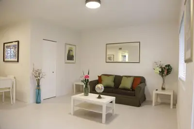 a living room with a couch and two tables at Apt 5 Miami Designer Apartment in the Upper East-Side in Miami