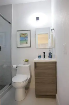 a bathroom with a toilet and a sink at Apt 6 Miami Designer Studio in the Upper East-Side in Miami
