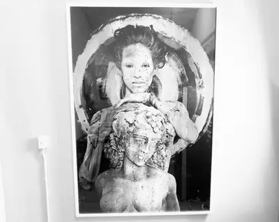 a picture of a statue of a woman and a bust at Shenandoah Victorian Suite with TV's in every room in Miami