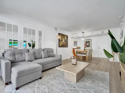 a living room with a couch and a table at Comfortable Ocean View Condo Beach Service 1214 in Miami Beach