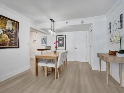 a dining room with a table and chairs at Comfortable Ocean View Condo Beach Service 1214 in Miami Beach