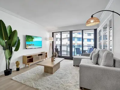 a living room with a couch and a table at Comfortable Ocean View Condo Beach Service 1214 in Miami Beach