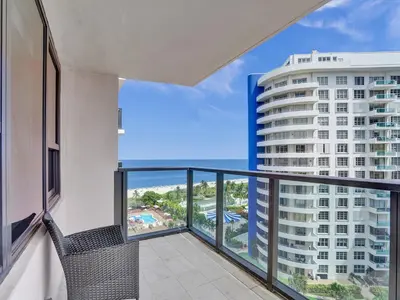 a balcony with a view of a building at Amazing Ocean View Condo Beach Service 1111 in Miami Beach