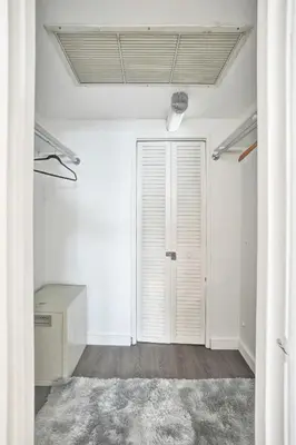 a white room with a door and a carpet at Spacious Ocean View Condo Beach Service 803 in Miami Beach