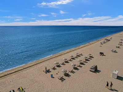 an overhead view of a beach with chairs and umbrellas at Huge 2BD Miami beach with beach service - 720 in Miami Beach