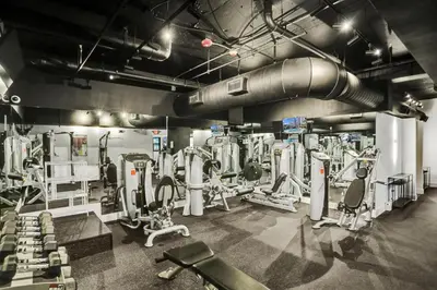a gym with a lot of machines and weights at Luxury Oceanfront Condo Magnificent Views 701 in Miami Beach