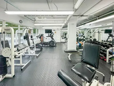 a gym with lots of treadmills and machines at The Octagon in South Beach in Miami Beach