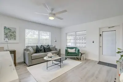 a living room with a couch and a ceiling fan at Pool Access Free Parking Smart TV Wifi in Fort Lauderdale