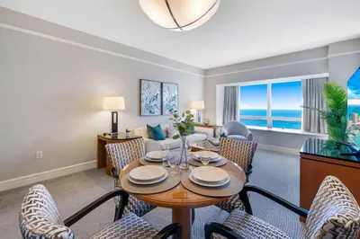 a living room with a table and chairs at 1435 Brickell Ave 3004 in Miami
