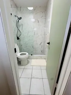a bathroom with a toilet and a walk in shower at Miami Coral Gables Studio near Airport and Beaches in Miami