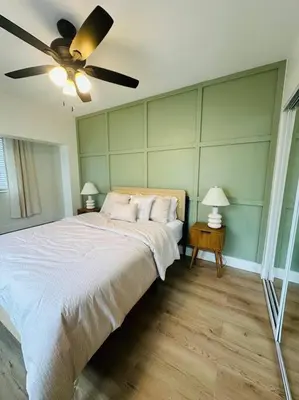 a bedroom with a bed and a ceiling fan at Miami Coral Gables Studio near Airport and Beaches in Miami