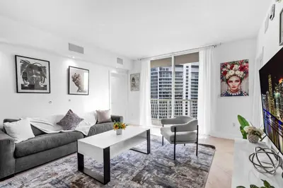 a living room with a couch and a table at Spacious 2 Bed Unit in Brickell with Free Parking in Miami