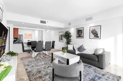 a living room with a couch and a table at Spacious 2 Bed Unit in Brickell with Free Parking in Miami