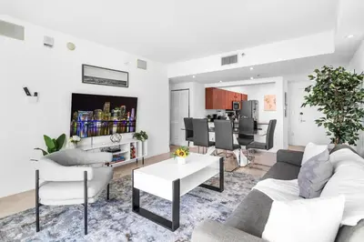 a living room with a couch and a table at Spacious 2 Bed Unit in Brickell with Free Parking in Miami