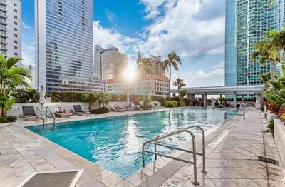 a large swimming pool in a city with tall buildings at Brickell 31th Floor Sea View Free Parking by Palermo Home Miami in Miami