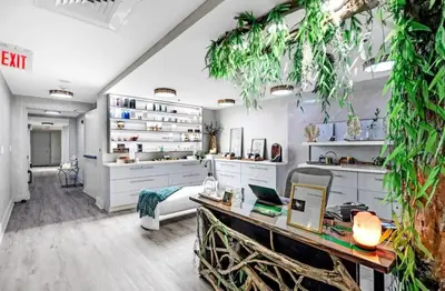 a living room with a desk and some plants at Brickell 31th Floor Sea View Free Parking by Palermo Home Miami in Miami
