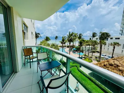 a balcony with chairs and a view of the beach at Special $$$! 2 Bedroom Oceanfront Condo in Hollywood/Hallandale Beach! in Hollywood