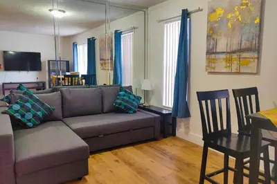 a living room with a couch and a table at Sunny Isles Apartments by MiaRentals in Sunny Isles Beach