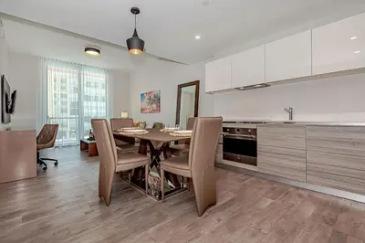 a kitchen and dining room with a table and chairs at Hollywood Beach Rooftop Pool Balcony in Hollywood