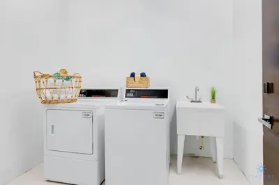 a kitchen with white appliances and a sink at Hollywood Beach Rooftop Pool Balcony in Hollywood