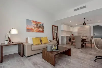 a living room with a couch and a table at Hollywood Beach Rooftop Pool Balcony in Hollywood