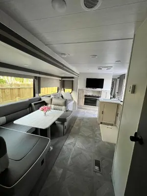 a living room with a couch and a table at Free BBQ in RV With Private entrance in Homestead