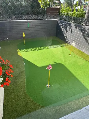 a miniature golf course with a golf ball on the grass at Stylish Room close to everything in Miami in Miami Shores