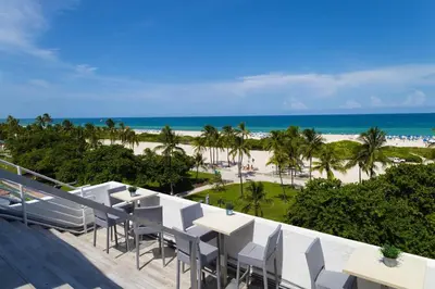 a view of the beach from the balcony of a resort at 1-Bed Apt with rooftop pool Ocean Dr by the Beach B207 in Miami Beach