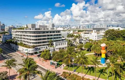 a cityscape of a city with buildings and palm trees at Hotel Miami Beach Convention Center in Miami Beach