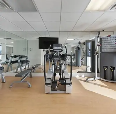 a room with a gym with several exercise machines at Hotel Miami Beach Convention Center in Miami Beach