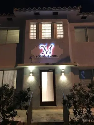 a sign on the front of a building at M HOTEL in Miami Beach