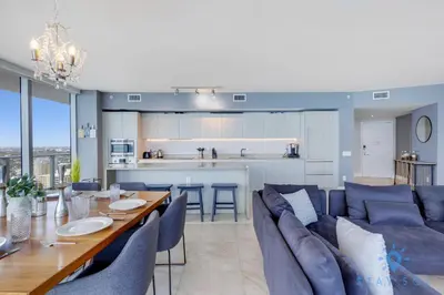 a kitchen and living room with a table and chairs at Oceanview Luxury 3BR Sky Home Amaizing Pool in Hollywood