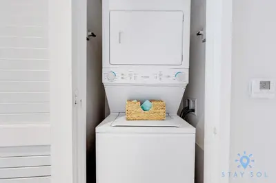 a washer and dryer with a basket on top of it at Oceanview Luxury 3BR Sky Home Amaizing Pool in Hollywood
