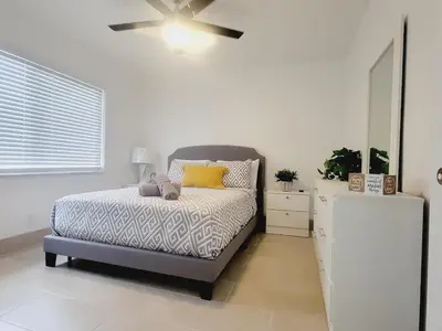 a bedroom with a bed and a ceiling fan at Arpe 4plex in Fort Lauderdale