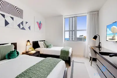 a hotel room with two beds and a window at Amazing Pools Luxury 2Br Front Ocean Bay View in Hollywood