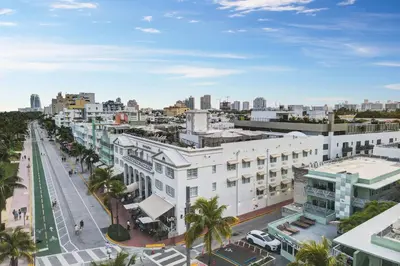 an aerial view of a city with buildings and palm trees at Ocean Drive Prime Apt w/2 QueenBeds & Washer/Dryer in Miami Beach