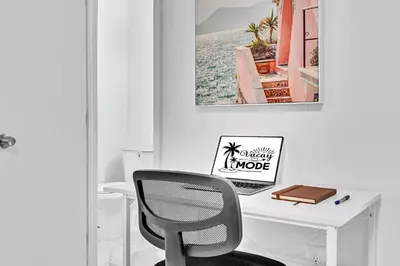 a white desk with a chair in a room at Executive Studio Suite Hollywood Beach Blvd in Hollywood