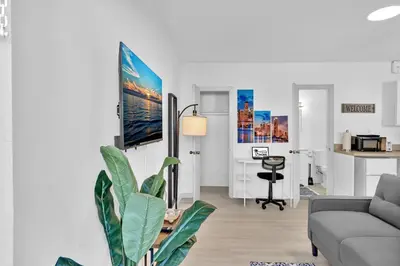 a living room with a couch and a table at Young Circle & Hollywood Blvd Posh Studio Suite in Hollywood