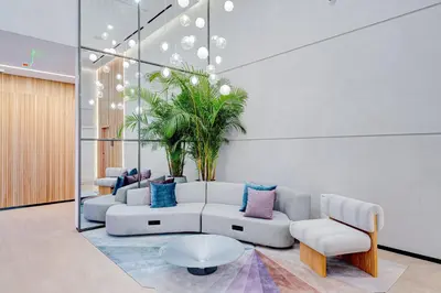 a living room with a couch and a plant at 227-2500FU DOWNTOWN MIAMI 1 BEDROOM CONDO in Miami