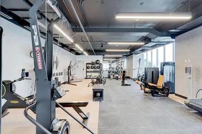 a gym with treadmills and machines in a room at 227-2500FU DOWNTOWN MIAMI 1 BEDROOM CONDO in Miami