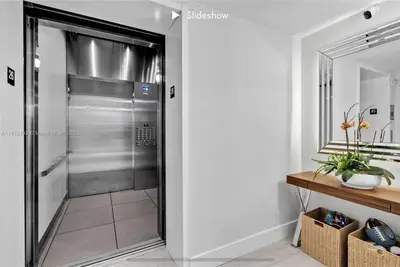 a walk in shower in a bathroom with a glass door at Apartment 3B/3B Stunning view of the intercostal in Hallandale Beach