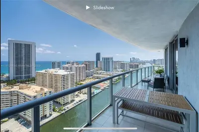 a balcony with a bench on top of a building at Apartment 3B/3B Stunning view of the intercostal in Hallandale Beach