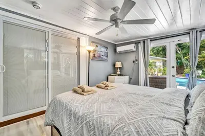 a bedroom with a bed and a ceiling fan at Family Home 2BR Heated Pool, Victoria Park in Fort Lauderdale