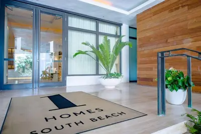 a welcome mat in a lobby with a home south island sign at Oceanview 1 Hotel & Homes 1 Bedroom 1 and Half Bathrooms Luxe Condo with Balcony in Miami Beach