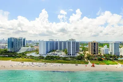 an aerial view of a beach and buildings at Oceanview 1 Hotel & Homes 1 Bedroom 1 and Half Bathrooms Luxe Condo with Balcony in Miami Beach