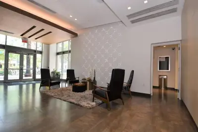 a living room with chairs and a table in it at Lovely Midblock building 1 bedroom 1 bathroom apartment in Miami